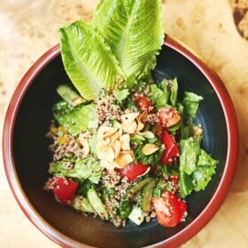 green vegetable salad on red bowl