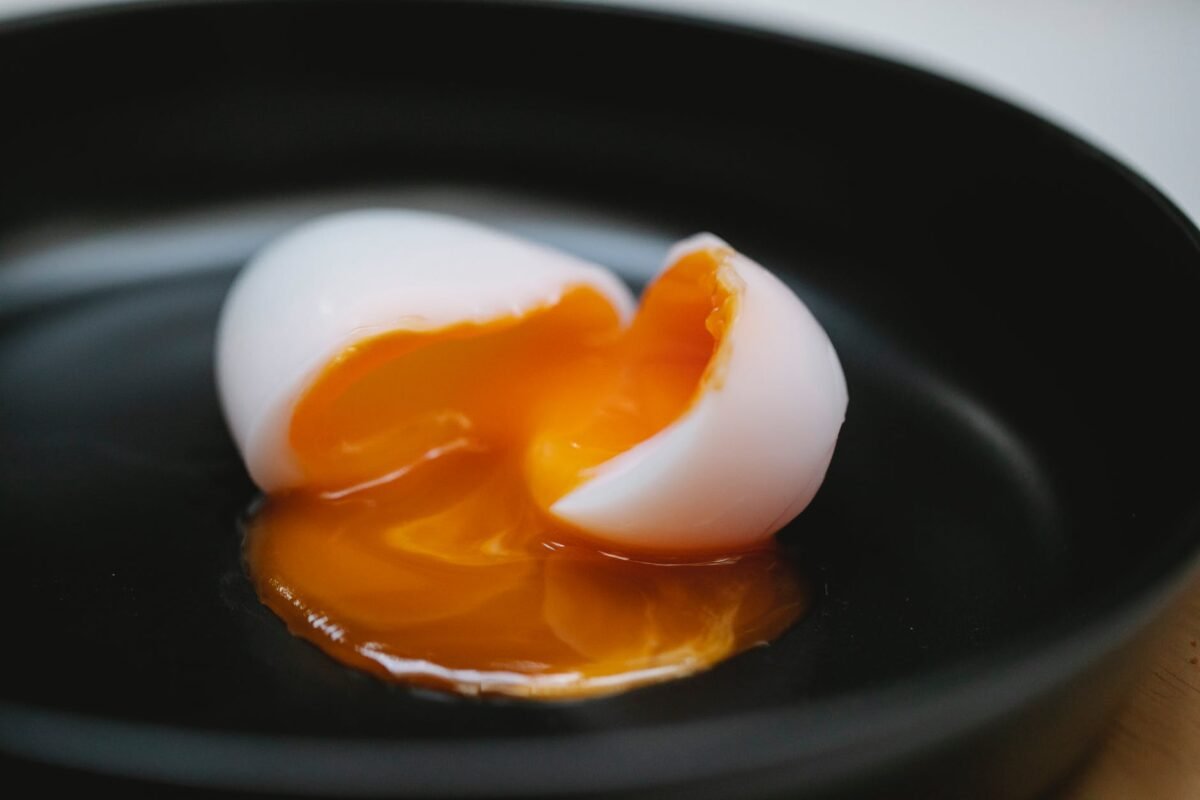 halves of soft egg in bowl