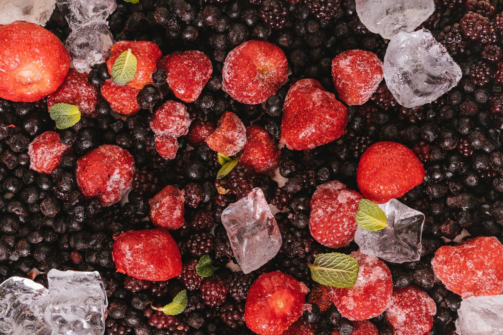 mint leaves on red fruits