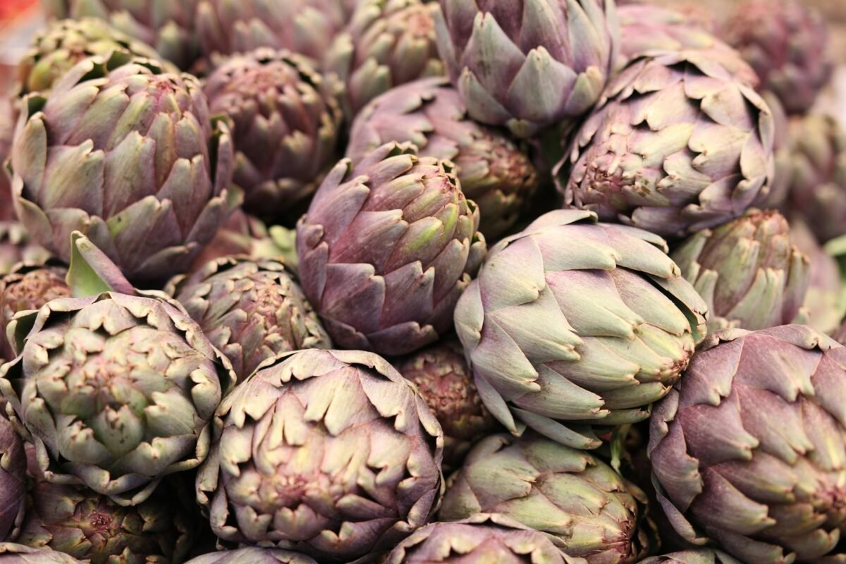 close up photo of pile of artichokes